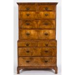 An early 18th Century walnut veneer fronted chest on chest:, with stained pine sides,