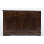 An 18th Century oak rectangular dresser base:, the top with a moulded edge,