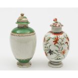 Two Worcester tea canisters and covers: one of plain ovoid form with flower finial,