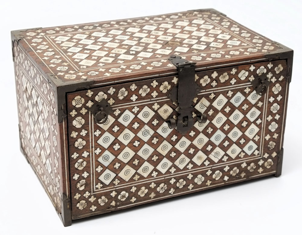 An Indo-Portuguese ivory inlaid coromandel table cabinet: the fall front enclosing one long drawer