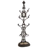 A cast iron hat and umbrella stand of Coalbrookdale type by Corneau Brothers:,