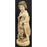 A Japanese carved ivory okimono of a Bijin: wearing traditional costume and holding a cage