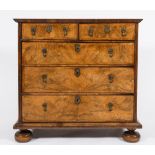 An early 18th Century walnut veneer and feather banded rectangular chest:,