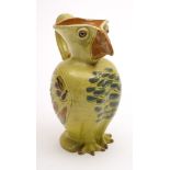 A William Baron (Barnstaple) pottery 'Puffin' jug: with applied ribbed strap handle,