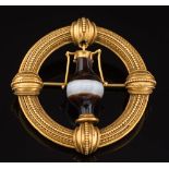 A 19th century gold and agate circular brooch: with central urn-shaped banded agate drop suspended