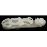 A Chinese carved white jade dragon belt hook: with dragon's head terminal,