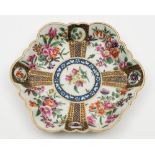 A Worcester lobed hexagonal teapot stand: finely painted with floral bouquets within fan shaped