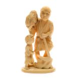 A Japanese carved ivory okimono of a farmer and child: the farmer holding a cockerel in one hand