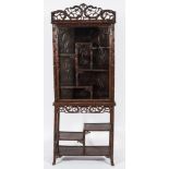 A Chinese carved hardwood and simulated bamboo decorated display cabinet on stand:,