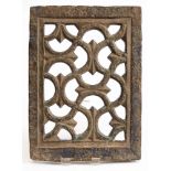 A Middle Eastern carved and pierced stone jali panel: carved with interlocking foliate scrollwork,