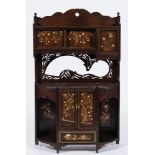 A late 19th Century Japanese Shibyama decorated wall cabinet:, with flowering trees,