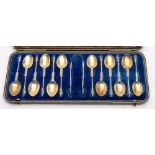 A set of twelve Victorian silver apostle teaspoons and tongs, maker William Gibson & John Langham,