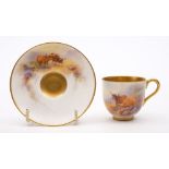 A Royal Worcester coffee cup and saucer painted by Harry Stinton: painted with vignettes of