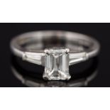 A platinum and emerald-cut diamond single-stone ring: with emerald-cut diamond approximately 6.