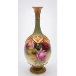 A Royal Worcester porcelain vase: of tear drop form with raised strap work to the shoulders and