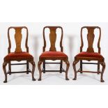 A set of eight walnut dining chairs in the George I manner:,