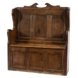 An 18th Century and later oak box settle:, of small size,