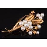 A cultured pearl mounted spray brooch: with twelve graduated cultured pearls the reverse stamped