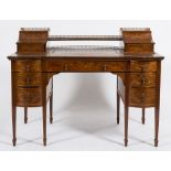 By Edwards & Roberts An Edwardian mahogany and marquetry writing desk:,