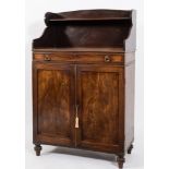 An early 19th Century mahogany chiffonier:, of small size with a shaped and shelved superstructure,