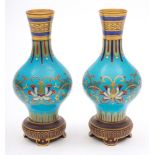 A pair of Minton Aesthetic Movement faux cloisonne porcelain vases: probably after a design by Dr.