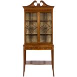 An Edwardian mahogany and marquetry display cabinet:, on a serpentine fronted stand,