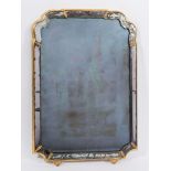 An 18th Century cartouche-shaped marginal wall mirror:, in a later gilt moulded frame,