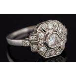 A diamond mounted rectangular cluster ring: with central circular diamond approximately 0.