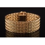 A 9ct gold mesh-link bracelet:, 20mm wide, approximately 17.8cm total length, 40gms gross weight.