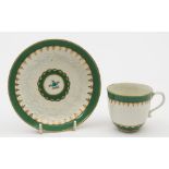 A Worcester apple green 'Chrysanthemum' pattern cup and saucer: with moulded chrysanthemum flowers