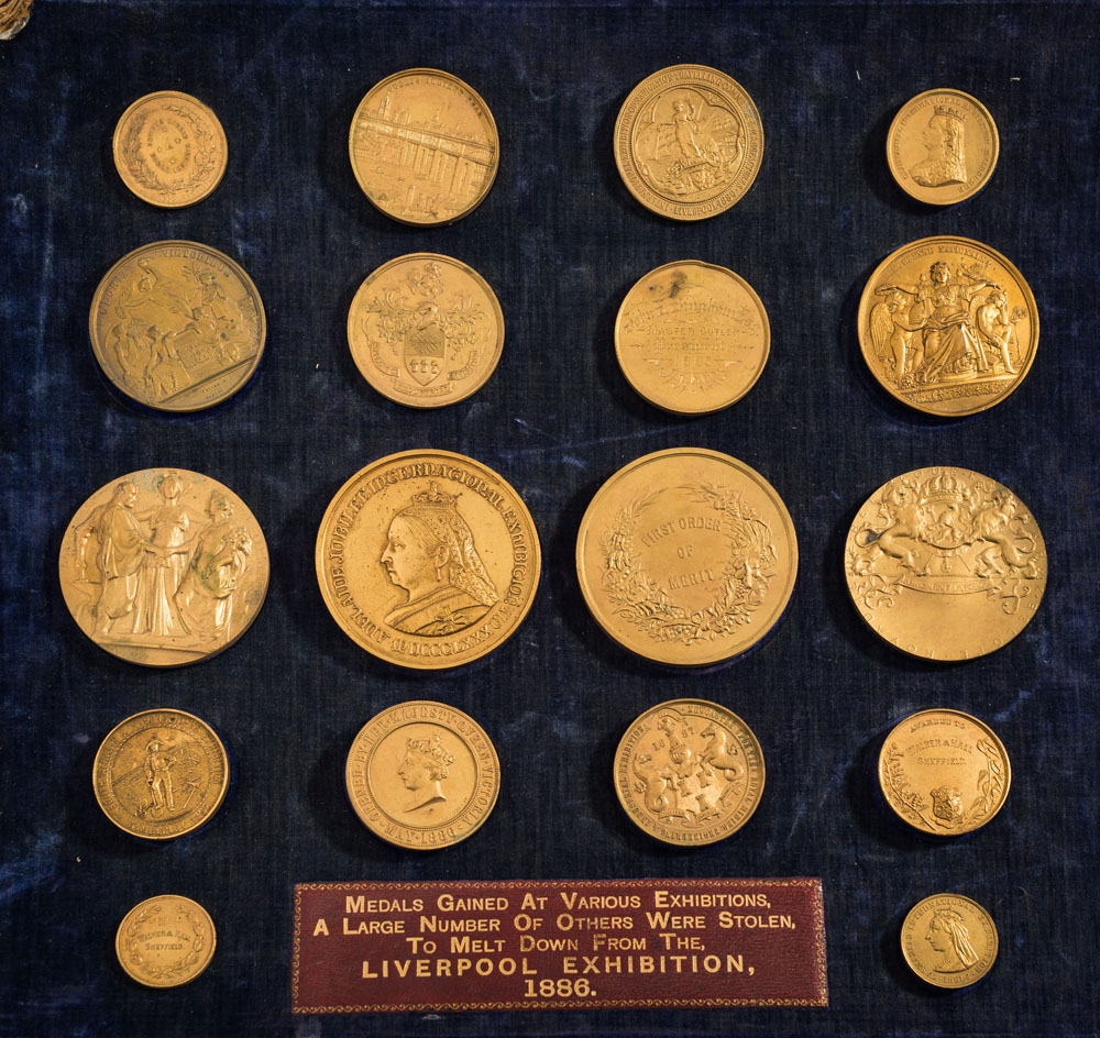 A collection of gilt metal medallions awarded to Walker and Hall Ltd: from various exhibitions,