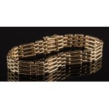 A 9ct gold four-bar gate-link bracelet:, approximately 22cm total length, 44gms gross weight.