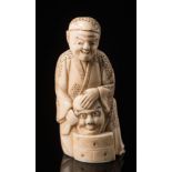 A Japanese carved ivory figure of an actor: Meiji period (1864-1912),