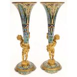 A pair of 19th century French gilt bronze and champleve vases: of trumpet form with floral enamel