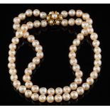 A graduated baroque cultured pearl two-string necklace: with a 9ct gold and cultured pearl mounted