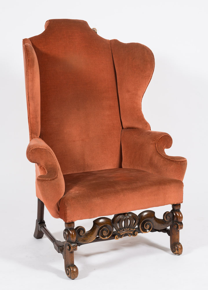 A 17th Century and later carved walnut wing back armchair:,