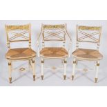 A set of five white and gilt decorated occasional chairs in the Regency taste:,