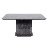 A polished granite pedestal centre table: of rectangular shape with canted angles on a stepped