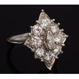 A diamond mounted marquise-shaped cluster ring: with central marquise-shaped diamond approximately