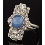 An art deco star sapphire and diamond rectangular cluster ring: with central oval star sapphire