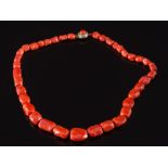 A graduated coral bead single-string necklace: with 38 irregular beads graduated from 10mm long to