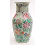 A Chinese porcelain vase: of baluster form enamelled in the famille rose palette with peony,