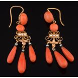 A pair of gold, coral and seed pearl drop earrings: each suspending three graduated coral drops,