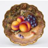 A Royal Worcester porcelain plate: of silver shape painted by Harry Ayrton with peaches,