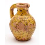 A Donyatt pottery puzzle jug: of typical bellied form with pierced neck and hollow rim and handle,
