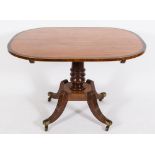A Regency satinwood, rosewood crossbanded and inlaid breakfast table:, of elliptical outline,