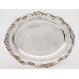 A George IV silver serving dish, maker William Kerr Read, London 1827: crested to border,