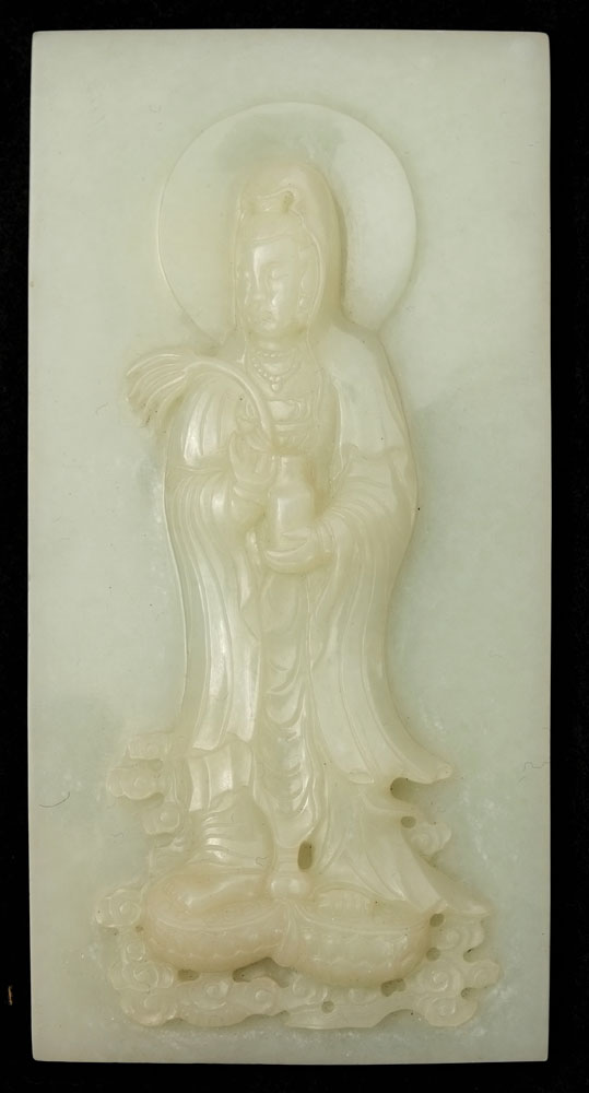 A Chinese jade rectangular plaque: carved to the centre with the figure of Guanyin holding a vase