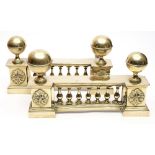 A pair of 19th century brass andirons: of baluster galleried form with cup and ball finial's,