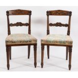 A set of four Regency Colonial carved rosewood dining chairs:,